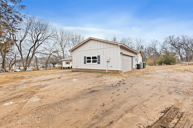 view of side of property with a garage