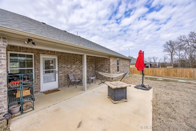 view of patio / terrace featuring an outdoor fire pit