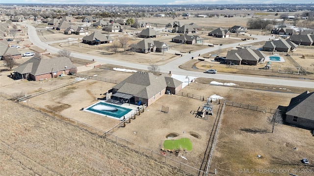 birds eye view of property with a residential view