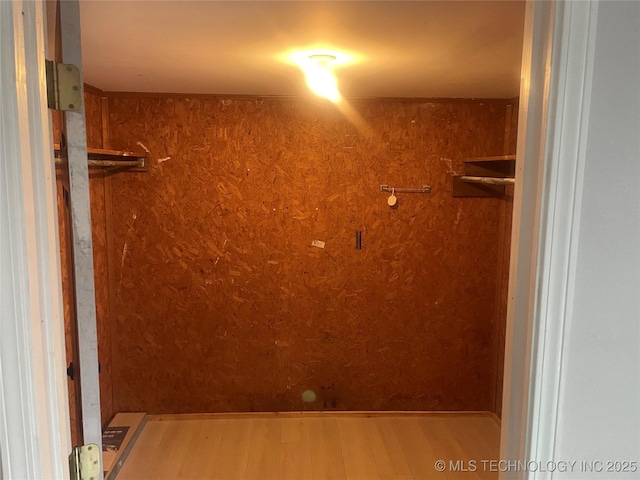 walk in closet featuring hardwood / wood-style flooring