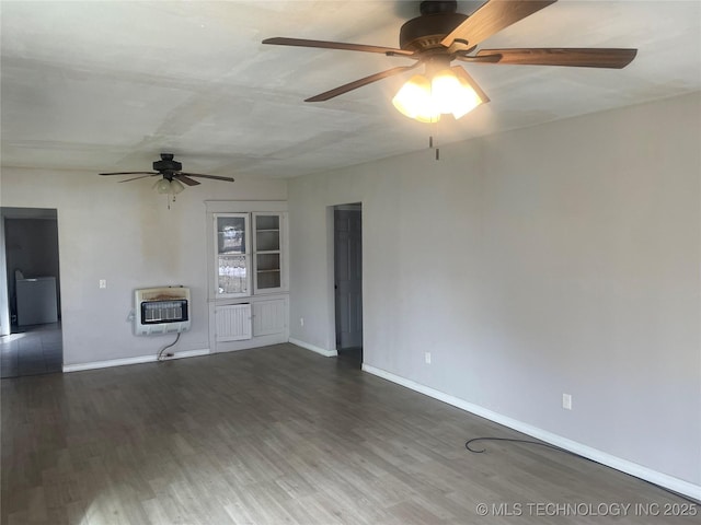 unfurnished living room with heating unit and dark hardwood / wood-style floors