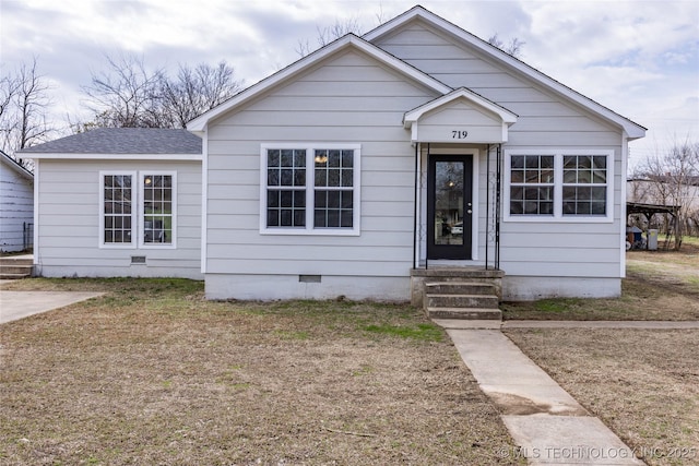 719 W Evergreen, Durant, OK 74701 - bungalow with entry steps, a shingled roof, and crawl space