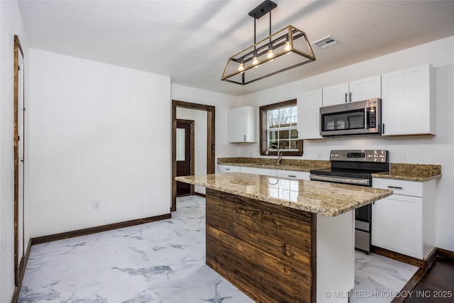 719 W Evergreen, Durant, OK 74701 - kitchen featuring white cabinetry, visible vents, appliances with stainless steel finishes, and a sink