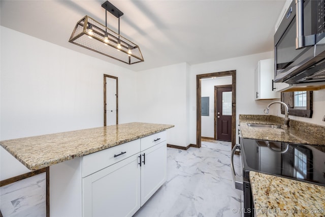 719 W Evergreen, Durant, OK 74701 - kitchen with white cabinets, light stone counters, marble finish floor, and a sink