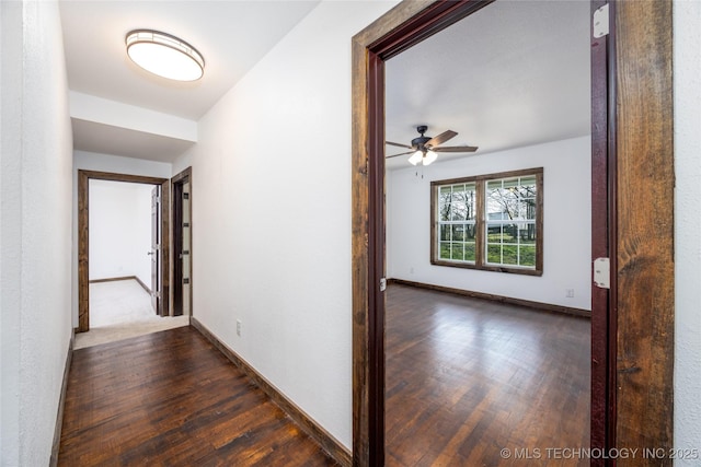 719 W Evergreen, Durant, OK 74701 - hallway featuring baseboards and dark wood finished floors