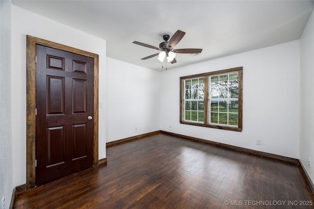 719 W Evergreen, Durant, OK 74701 - unfurnished room featuring dark wood-type flooring, baseboards, and ceiling fan