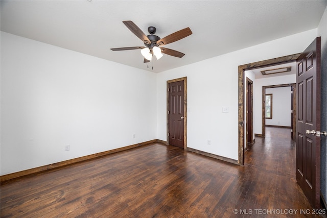 719 W Evergreen, Durant, OK 74701 - empty room with dark wood-type flooring, baseboards, and a ceiling fan