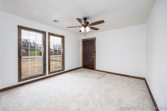 719 W Evergreen, Durant, OK 74701 - carpeted empty room featuring baseboards, visible vents, and a ceiling fan