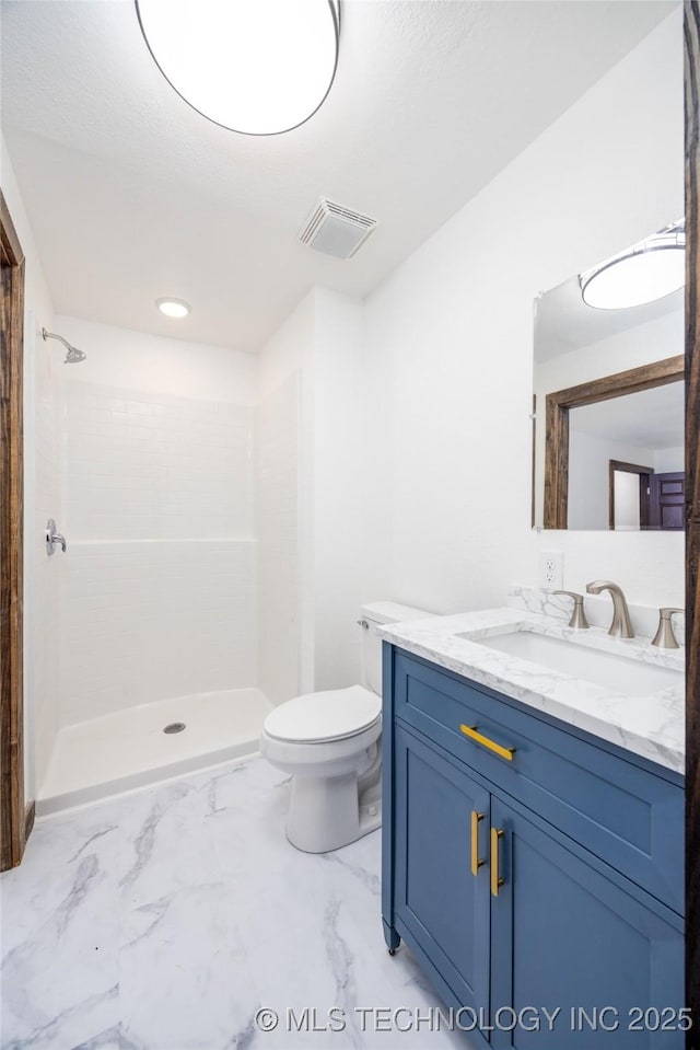 719 W Evergreen, Durant, OK 74701 - bathroom featuring a stall shower, toilet, marble finish floor, visible vents, and vanity
