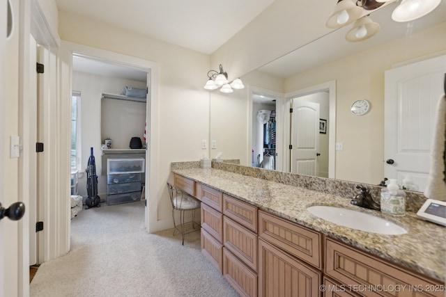 bathroom featuring vanity and baseboards