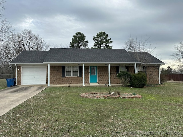 single story home with a garage, a front lawn, and covered porch