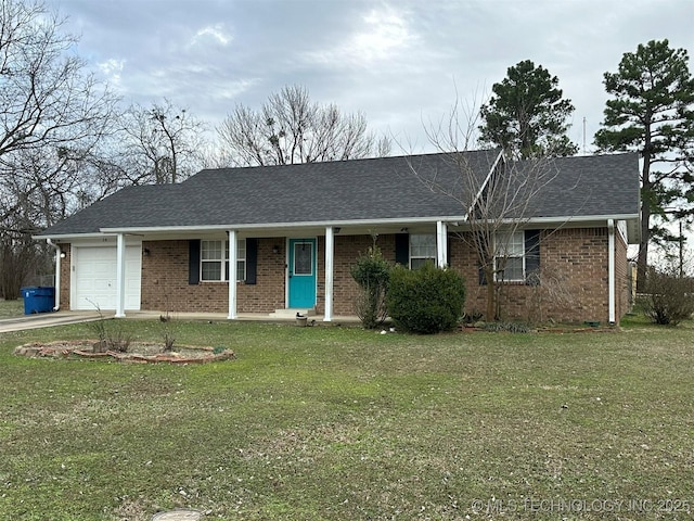 single story home featuring a garage and a front yard