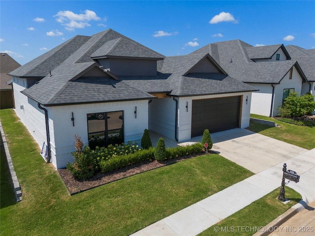 view of front of property with a garage and a front yard