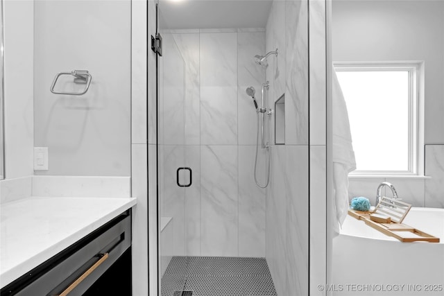full bath featuring a shower stall and vanity