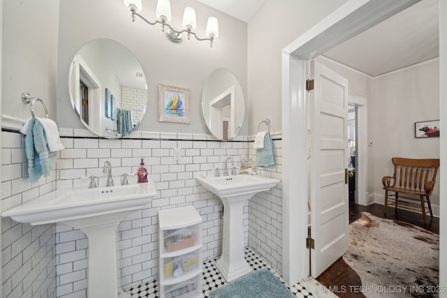 bathroom with tile walls and double sink