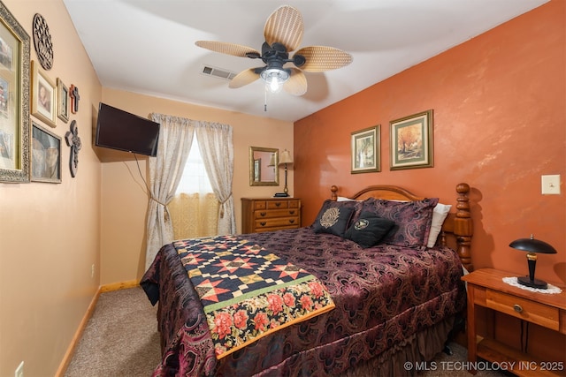 bedroom featuring carpet flooring, baseboards, visible vents, and ceiling fan