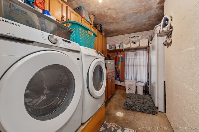 laundry area with laundry area, independent washer and dryer, and concrete block wall