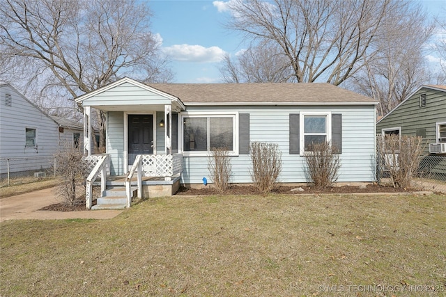 bungalow-style home featuring a front lawn