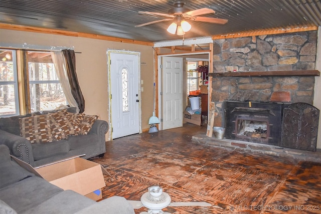 living room featuring ceiling fan and wooden ceiling