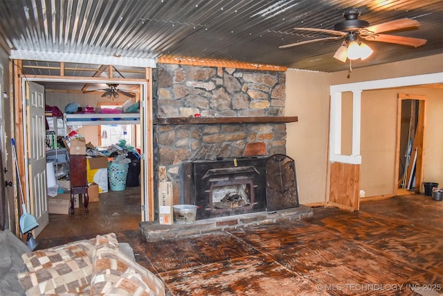 living room featuring a fireplace and ceiling fan