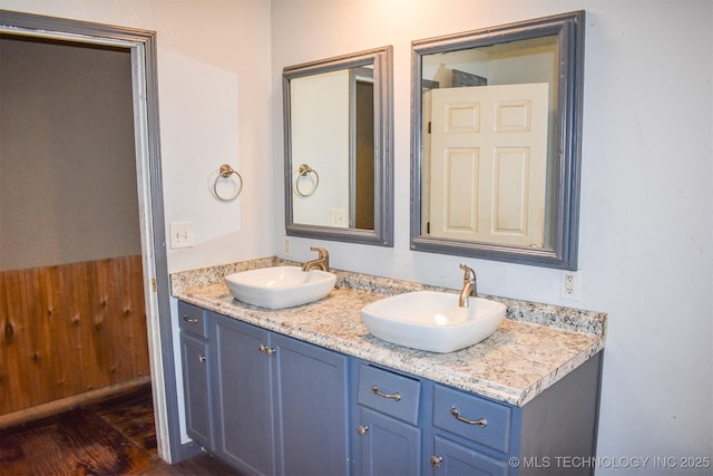 bathroom featuring hardwood / wood-style flooring and vanity