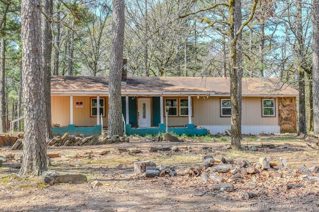 single story home featuring covered porch