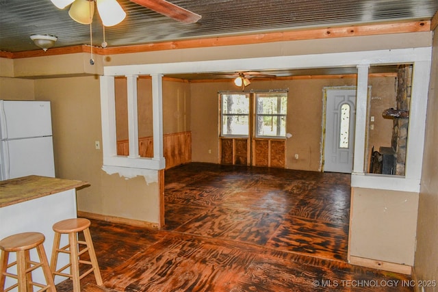 kitchen with freestanding refrigerator and a ceiling fan