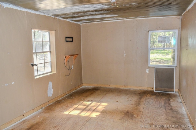 unfurnished room featuring a healthy amount of sunlight