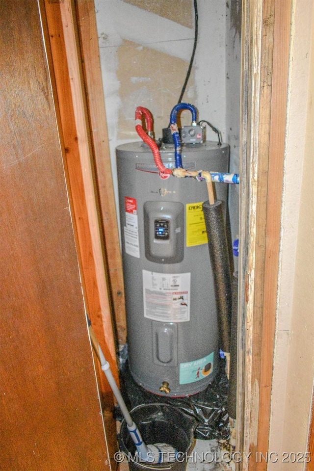 utility room featuring water heater
