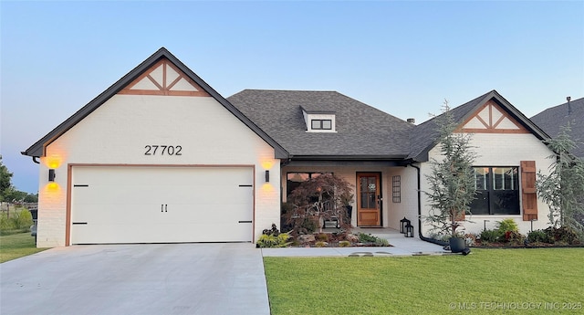 view of front of house with a front lawn and a garage