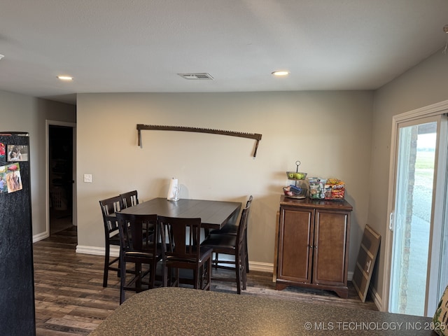 dining space featuring dark hardwood / wood-style flooring