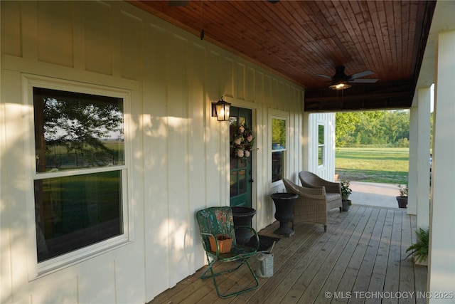 deck featuring covered porch and ceiling fan