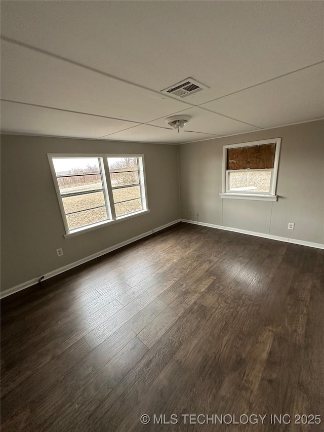 spare room featuring dark hardwood / wood-style flooring