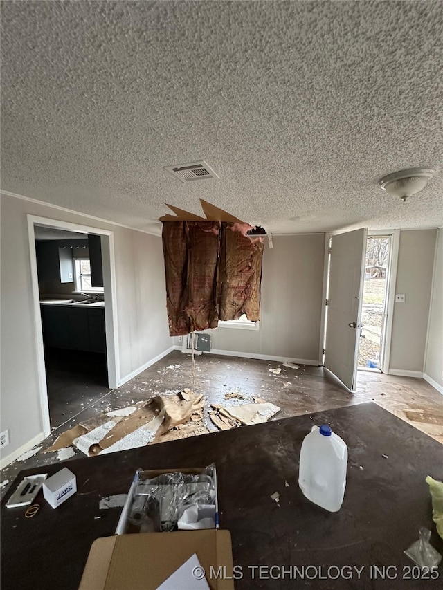 interior space featuring a textured ceiling