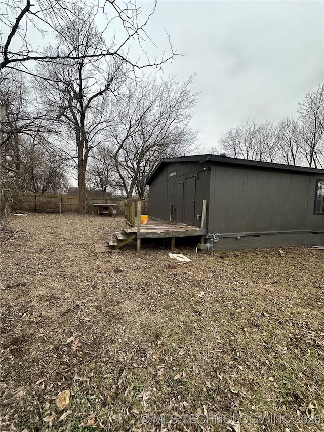 view of yard with a wooden deck