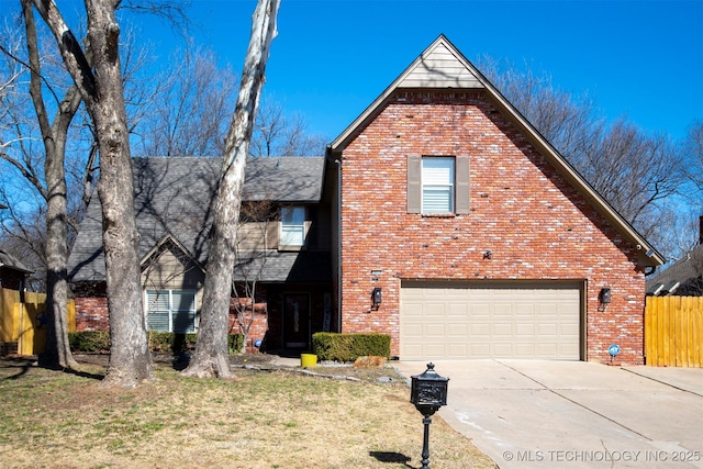 traditional-style house with brick siding, an attached garage, fence, driveway, and a front lawn