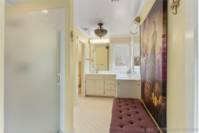 7637 S 26th W Ave, Tulsa, OK 74037 - bathroom with crown molding, a stall shower, tile patterned floors, and vanity