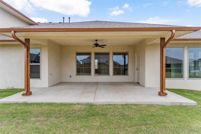 2982 E 145th St S, Bixby, OK 74008 - rear view of property featuring a ceiling fan, a yard, a patio, stucco siding, and roof with shingles