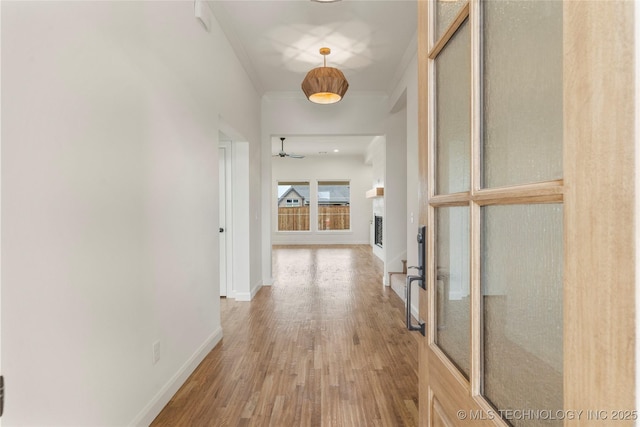 2982 E 145th St S, Bixby, OK 74008 - hall with baseboards, wood finished floors, and ornamental molding