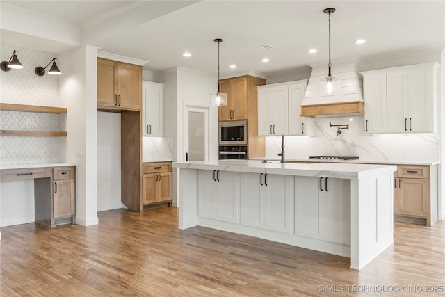 2982 E 145th St S, Bixby, OK 74008 - kitchen featuring decorative backsplash, stainless steel appliances, a kitchen island with sink, and light countertops
