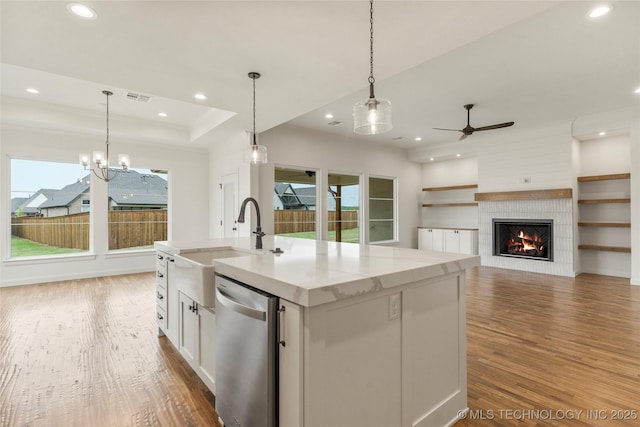 2982 E 145th St S, Bixby, OK 74008 - kitchen featuring wood finished floors, a sink, ceiling fan with notable chandelier, dishwasher, and recessed lighting