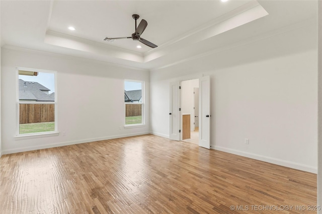2982 E 145th St S, Bixby, OK 74008 - spare room with a raised ceiling, light wood-type flooring, crown molding, and a ceiling fan