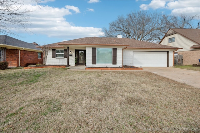 ranch-style home featuring brick siding, a chimney, concrete driveway, an attached garage, and a front lawn