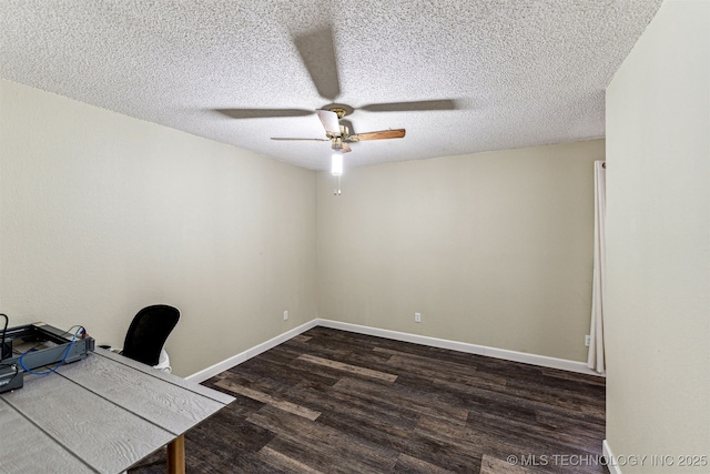 unfurnished office featuring a textured ceiling, dark wood-type flooring, and ceiling fan