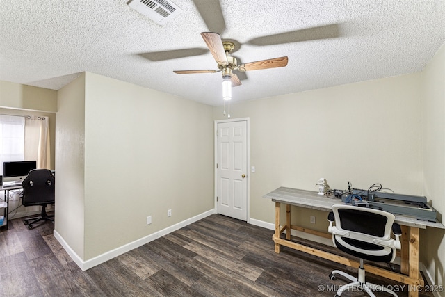 office space with ceiling fan, dark wood-type flooring, and a textured ceiling