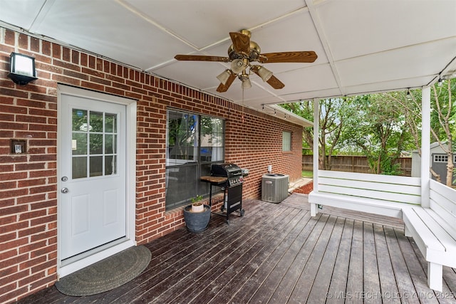 wooden deck featuring ceiling fan, central AC unit, and area for grilling