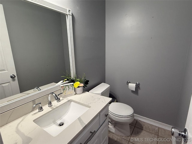 bathroom with tile patterned floors, toilet, and vanity