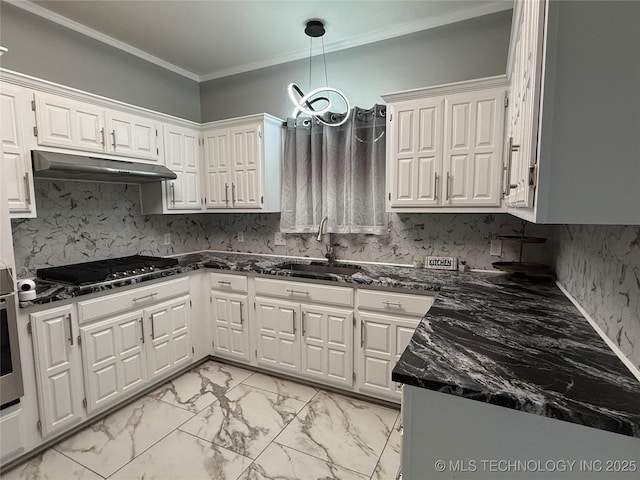 kitchen featuring sink, white cabinetry, dark stone counters, and stainless steel gas stovetop