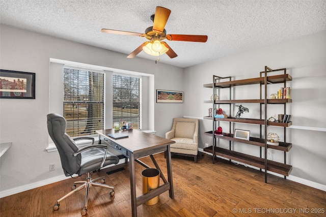 office space with baseboards, a ceiling fan, and wood finished floors