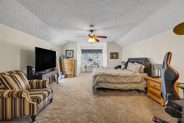 bedroom featuring lofted ceiling, carpet floors, a textured ceiling, and ceiling fan